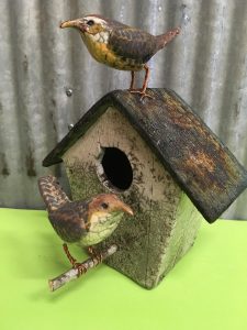 yellow birds with bird house